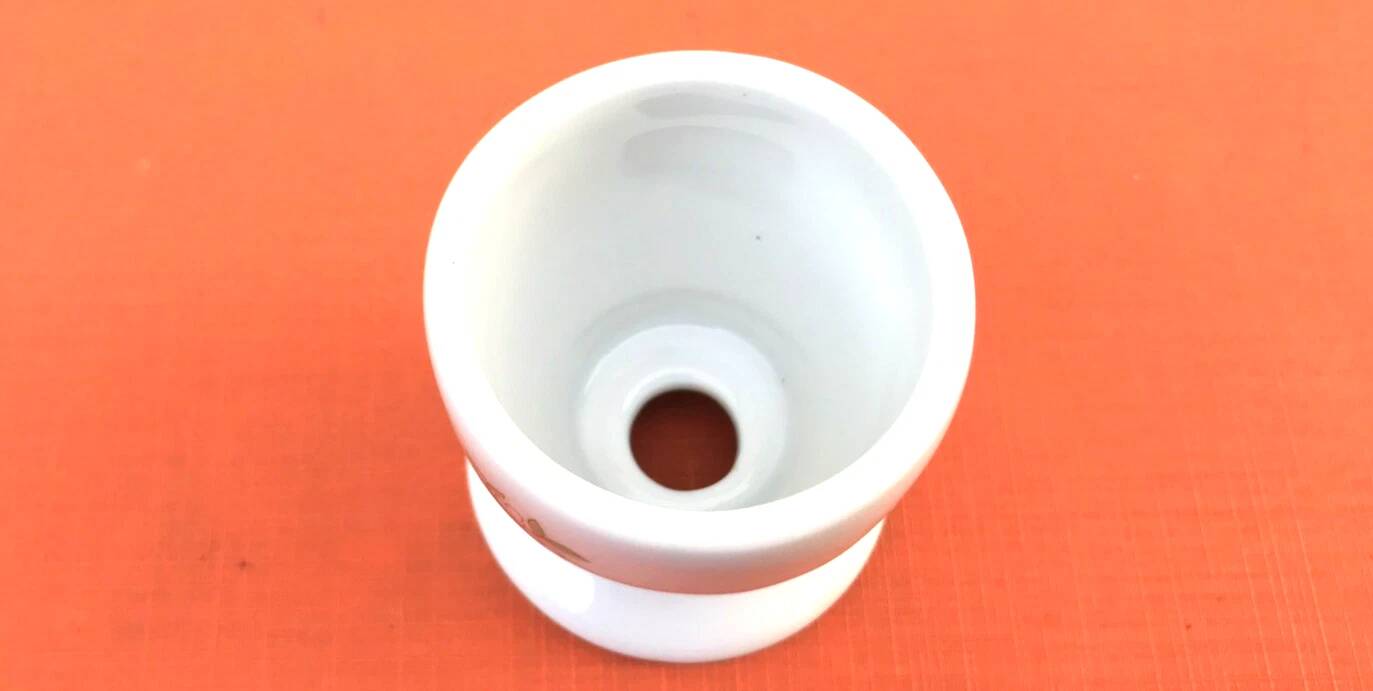 Ulysse Paris porcelain egg cup for Chanill with floral decoration.