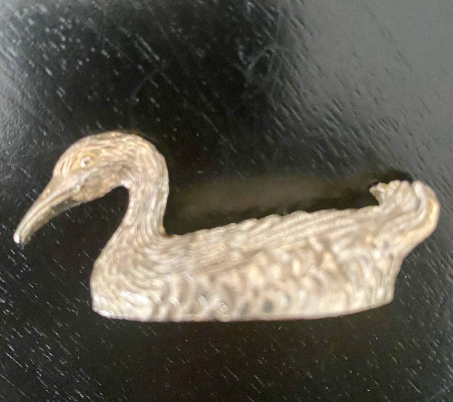 10 duck-shaped knife holders in silver-colored metal