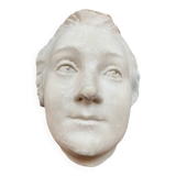 Plaster face wall statue