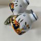 Antique egg holder by Jules Verlingue with polychrome floral decoration.