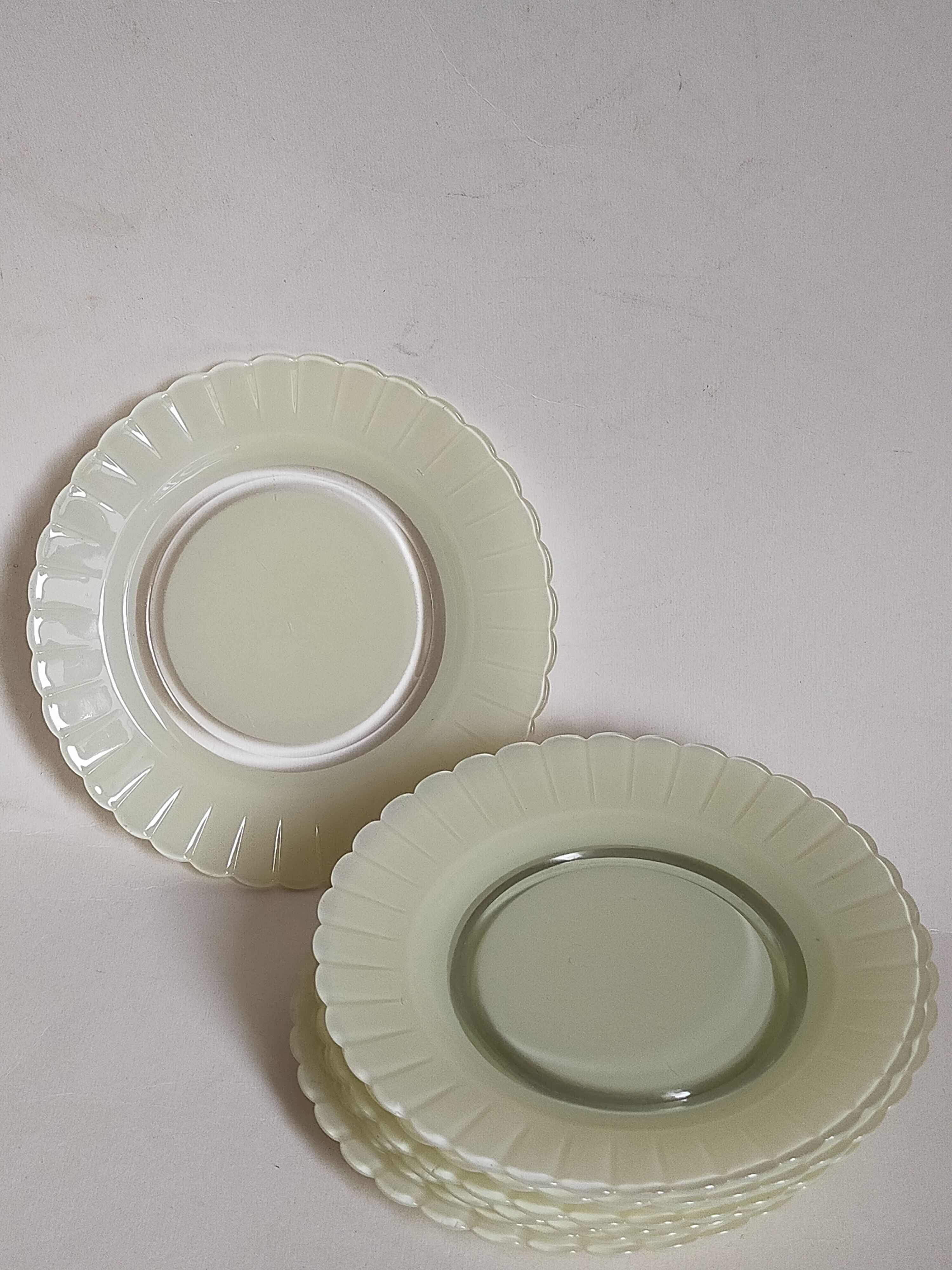 Eight Duralex dessert plates in 60s painted glass