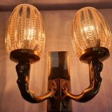 Golden bronze wall lamp with mermaids for an old bathroom.