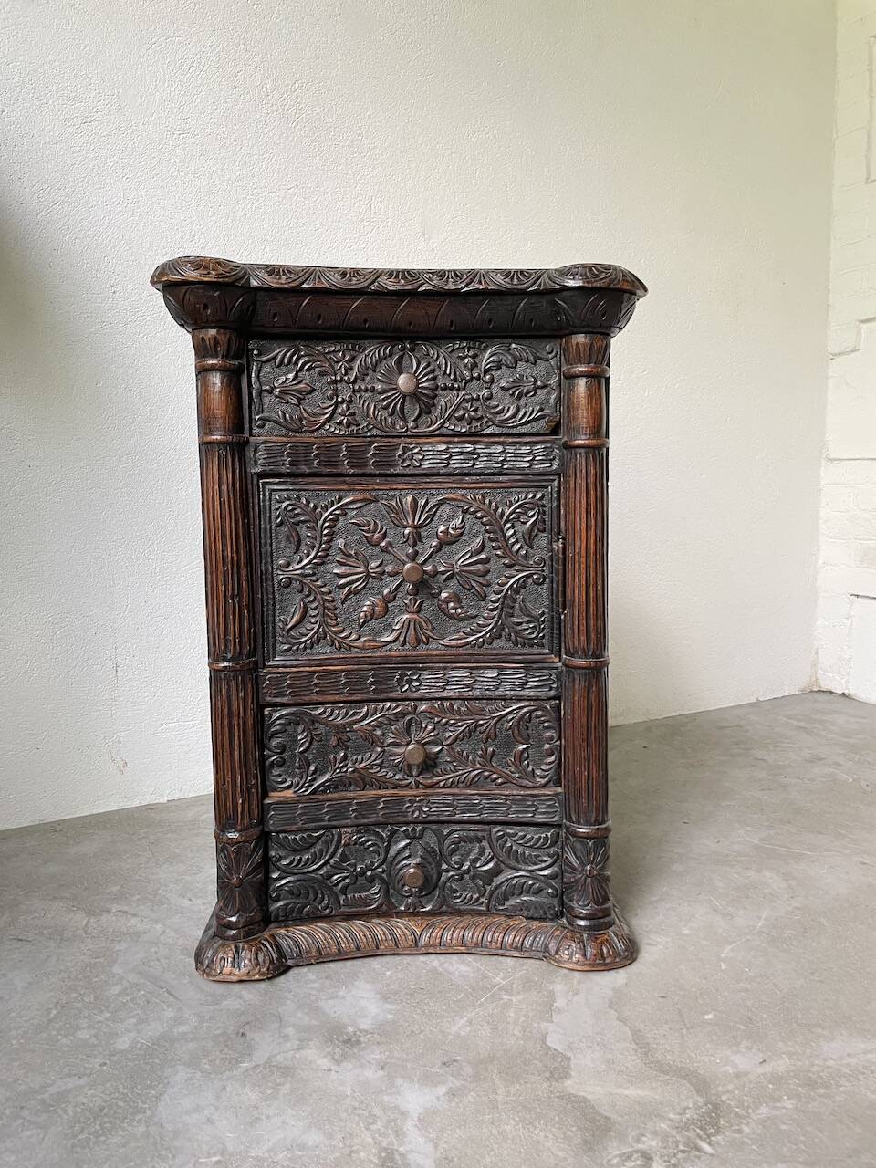 19th century chest of drawers in carved blackened pine