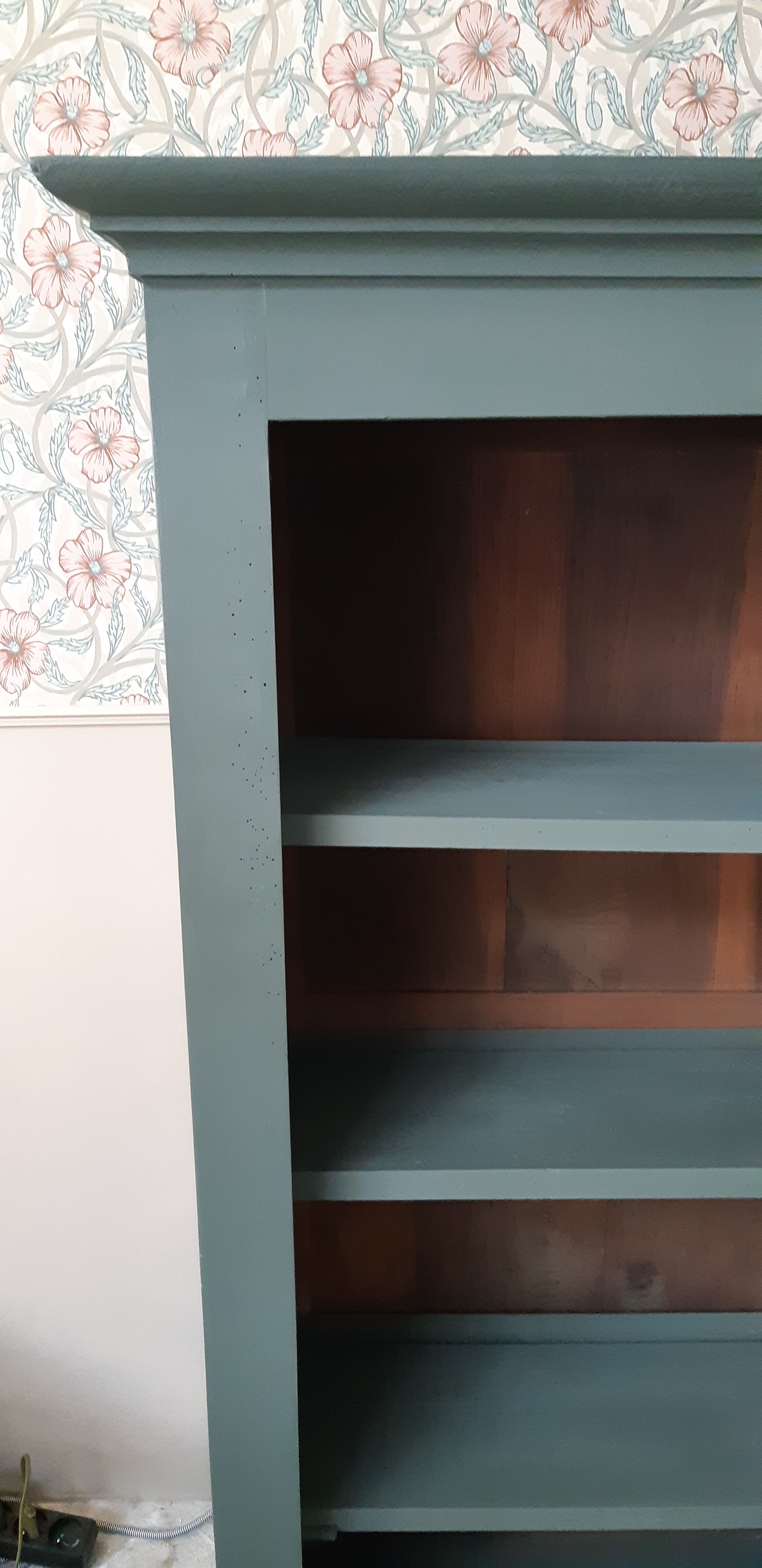 Wood and khaki green bookcase