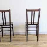 Pair of 1930s bistro chairs with patinated wood.