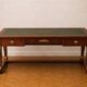 Empire-style centre desk in mahogany – with side pull-outs