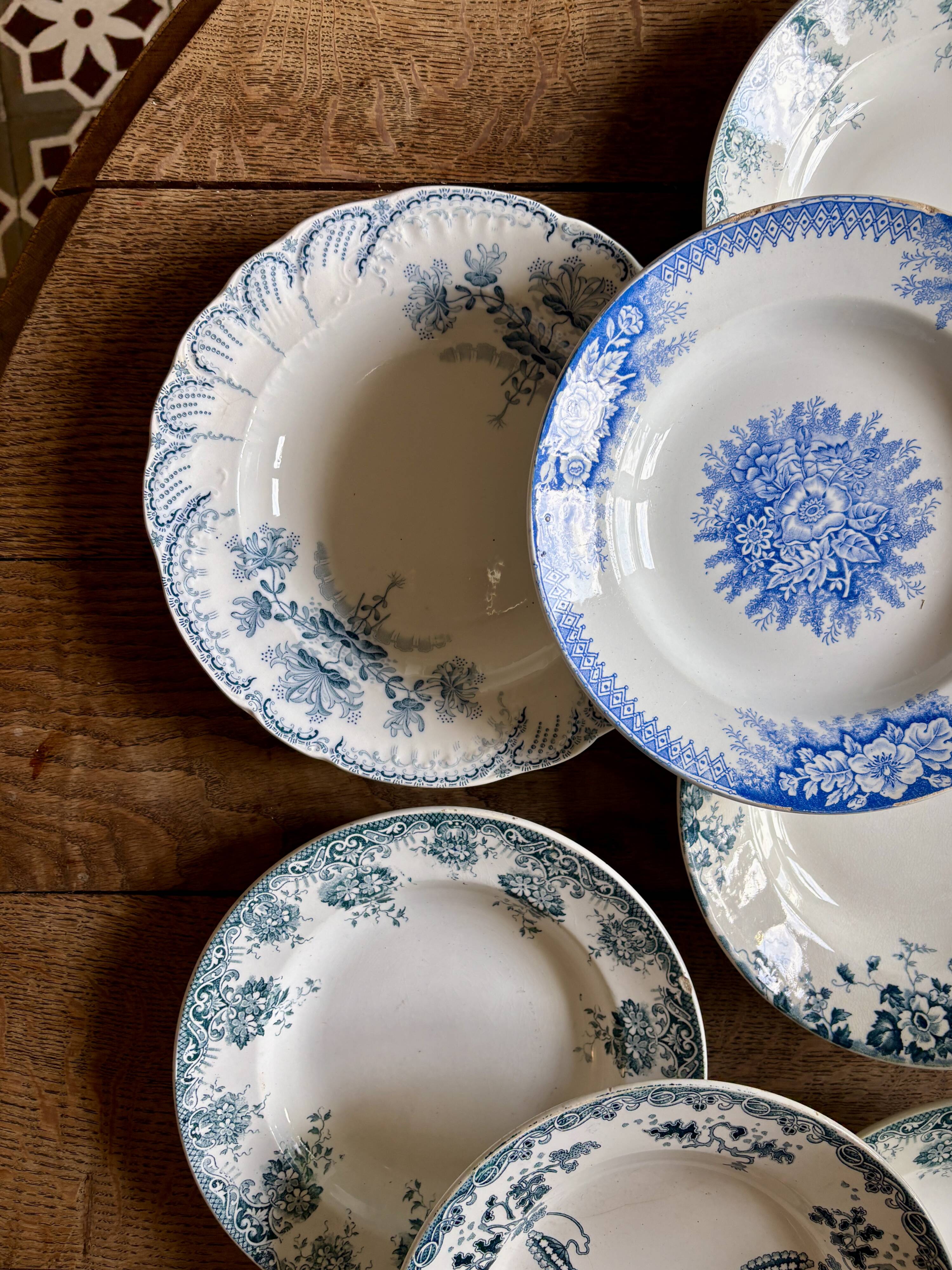 Set of 8 mismatched antique ironstone deep plates.