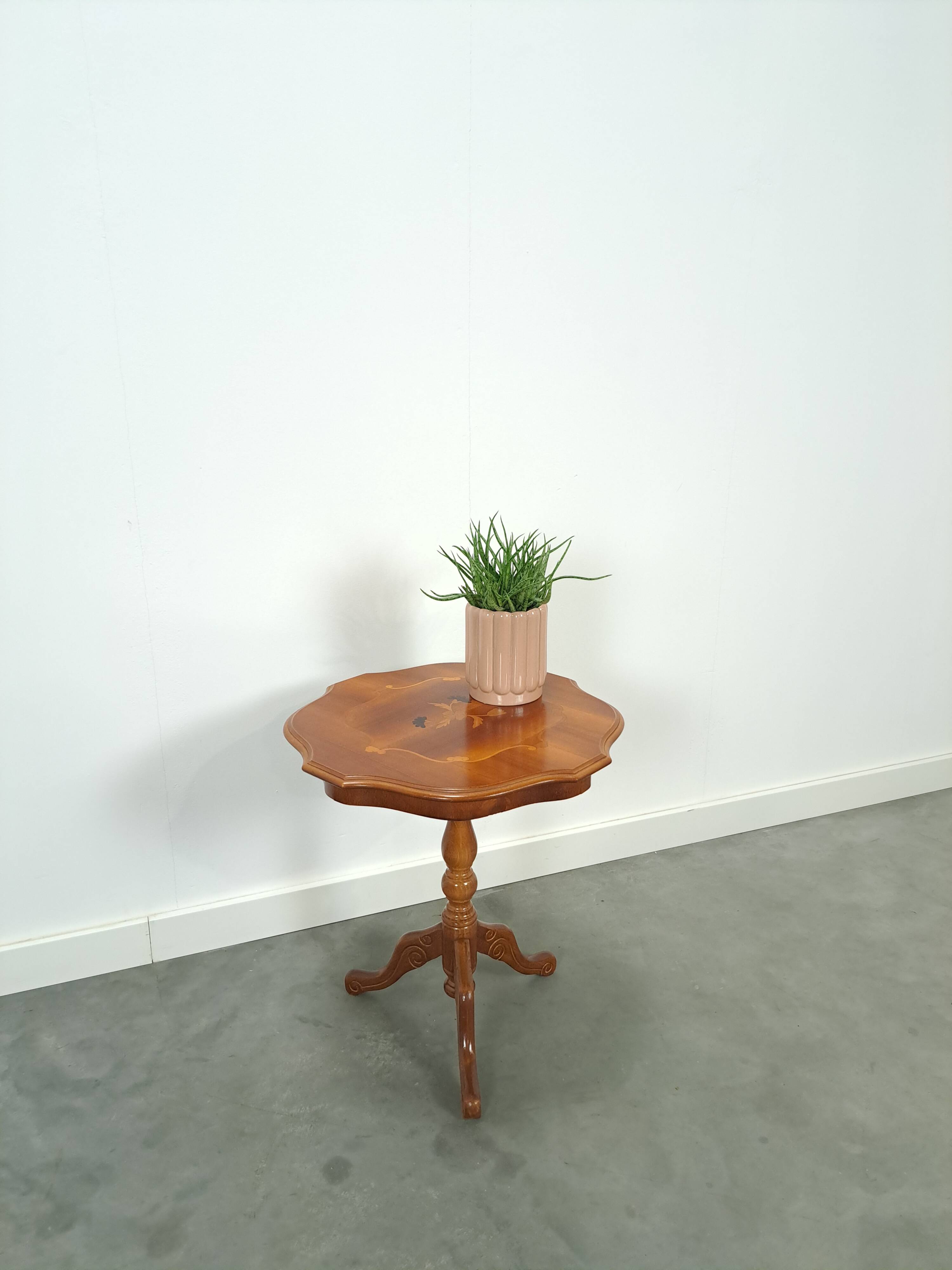 Round vintage wooden side table with inlaid veneer