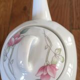 Vintage porcelain coffee or teapot with milk jug