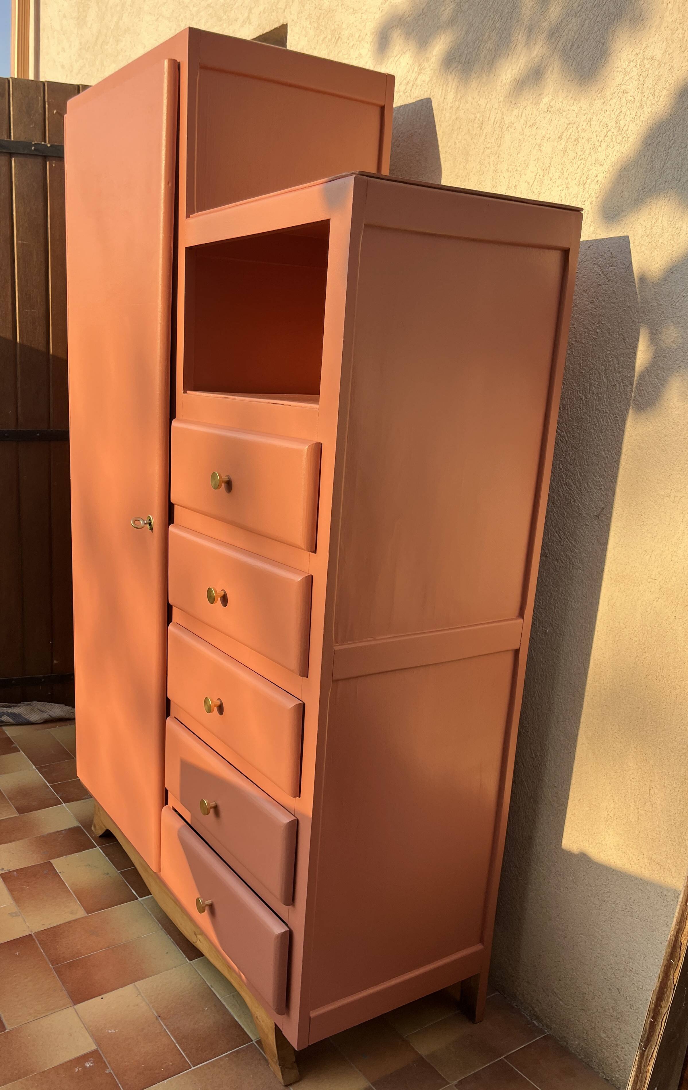 Asymmetrical vintage wardrobe painted in terracotta.