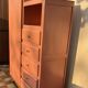 Asymmetrical vintage wardrobe painted in terracotta.