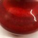 Red ceramic ball vase signed A
