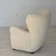 Fauteuil danois des années 1960, en véritable peau de mouton "Canberra", retapissé.