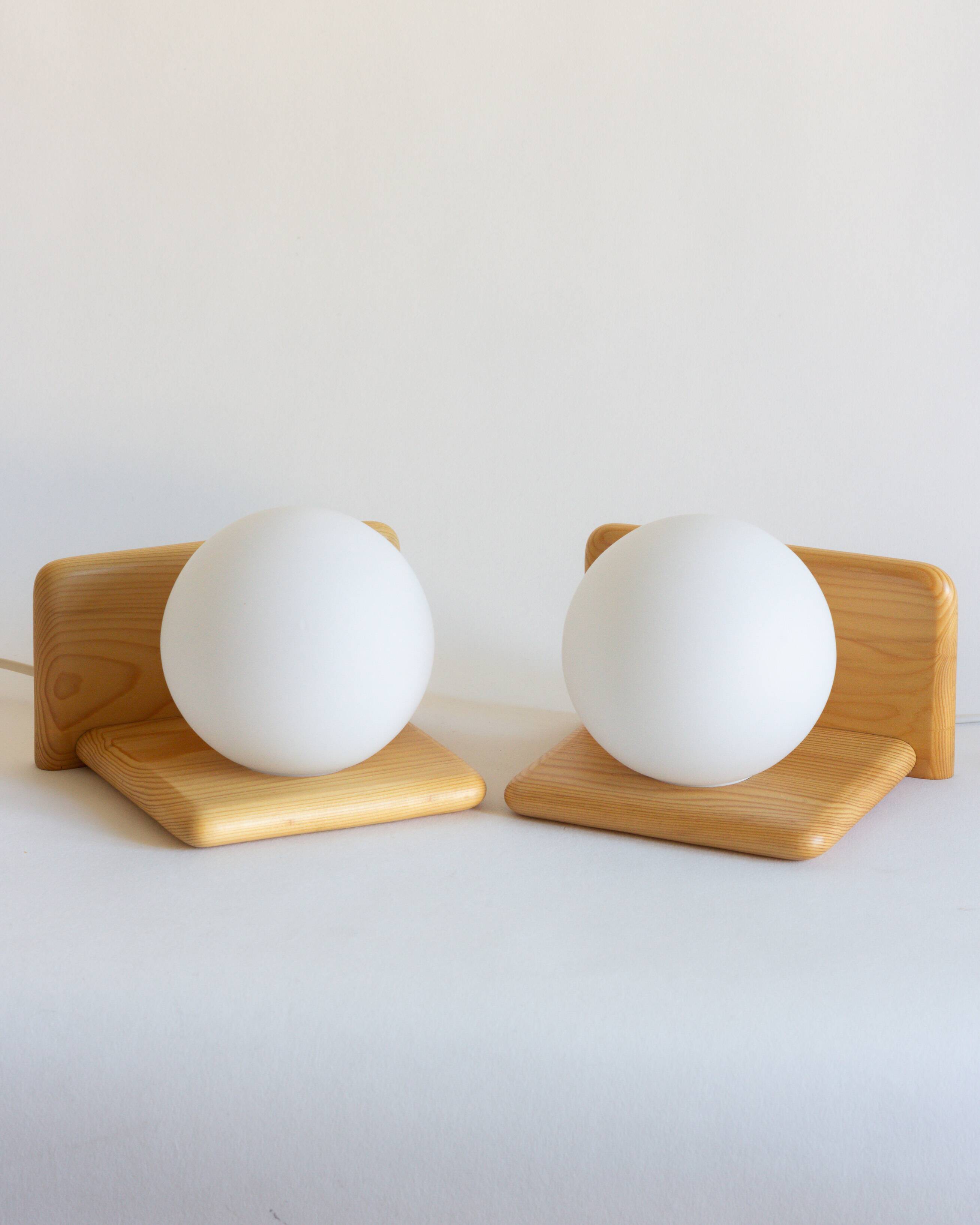 Duo of pine and opaline glass wall lights, 1980s