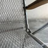 Pair of vintage silver aluminum wire folding chairs with wooden armrests — industrial minimalist