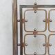 Double bed in burnished brass