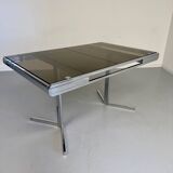 Smoked glass dining table with chrome legs, 1970s design by Roche Bobois.