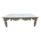 Painted wood coffee table with a distressed finish.