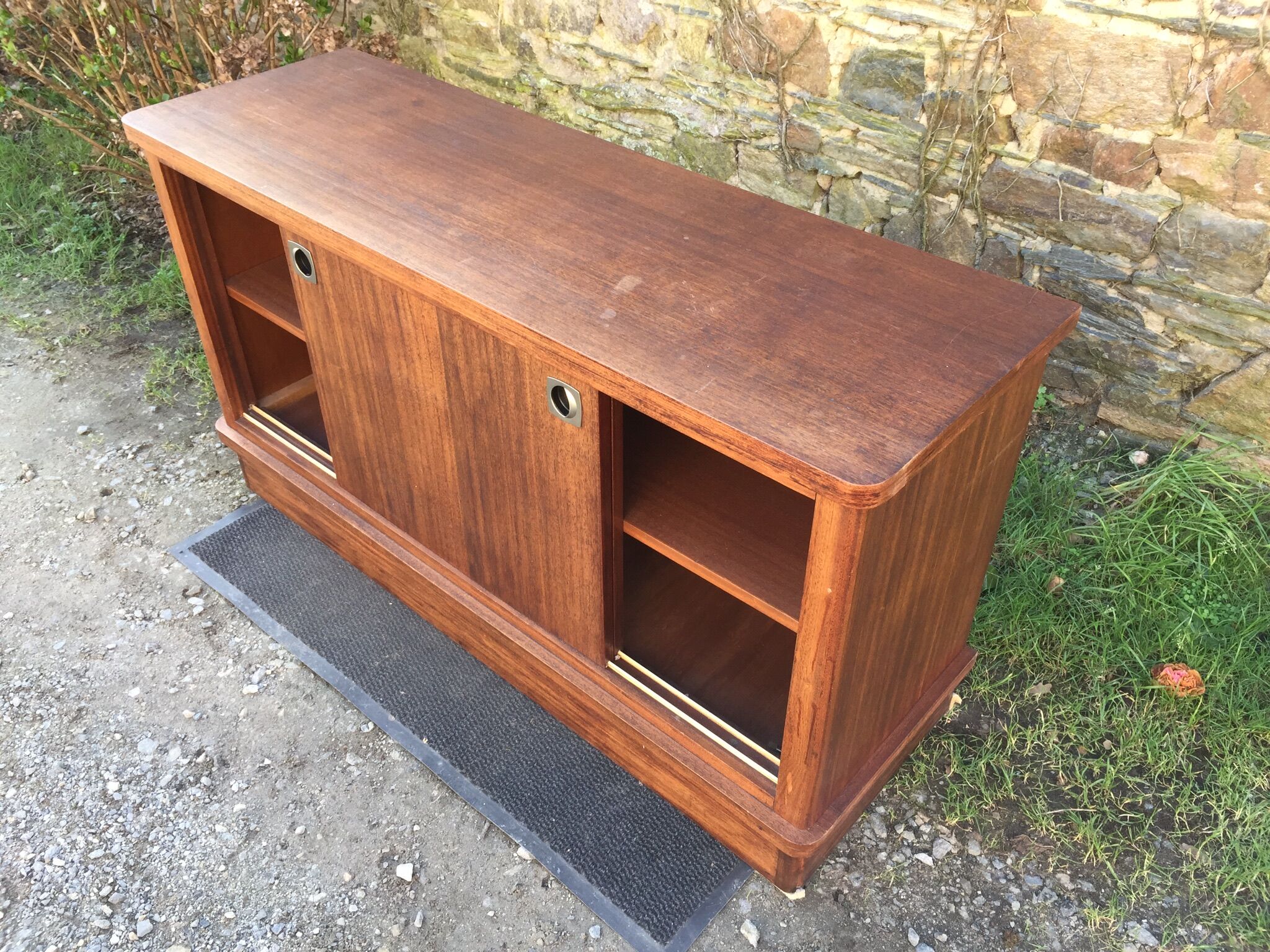 Low sideboard with sliding doors in waxed mahogany