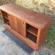 Low sideboard with sliding doors in waxed mahogany