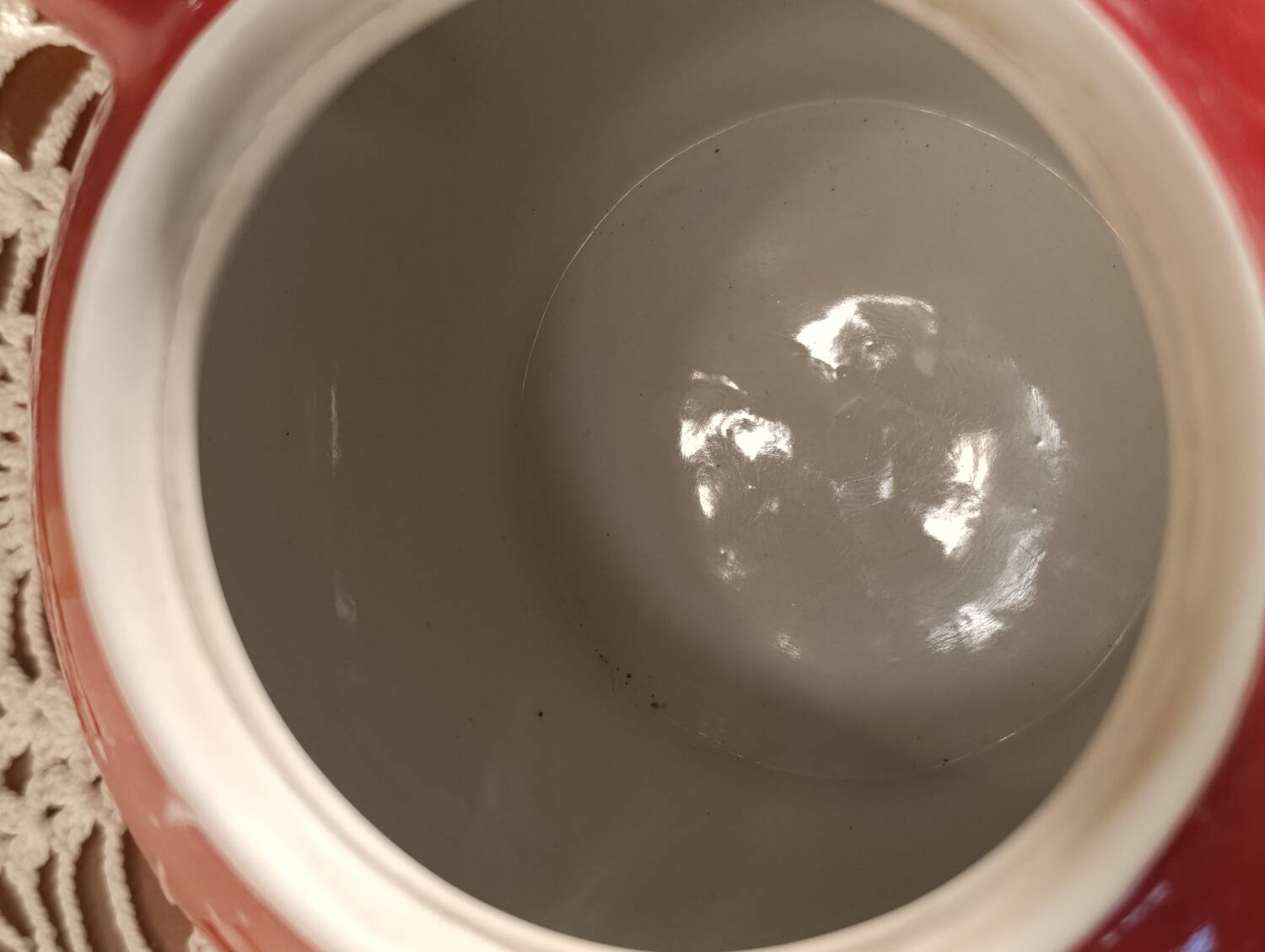 Vintage red teapot with white polka dots.