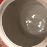 Vintage red teapot with white polka dots.