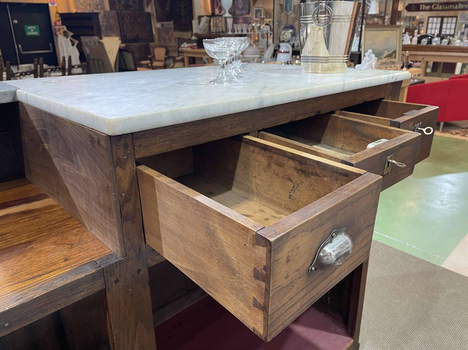 Bar counter in oak, zinc, and white marble from the early 20th century.