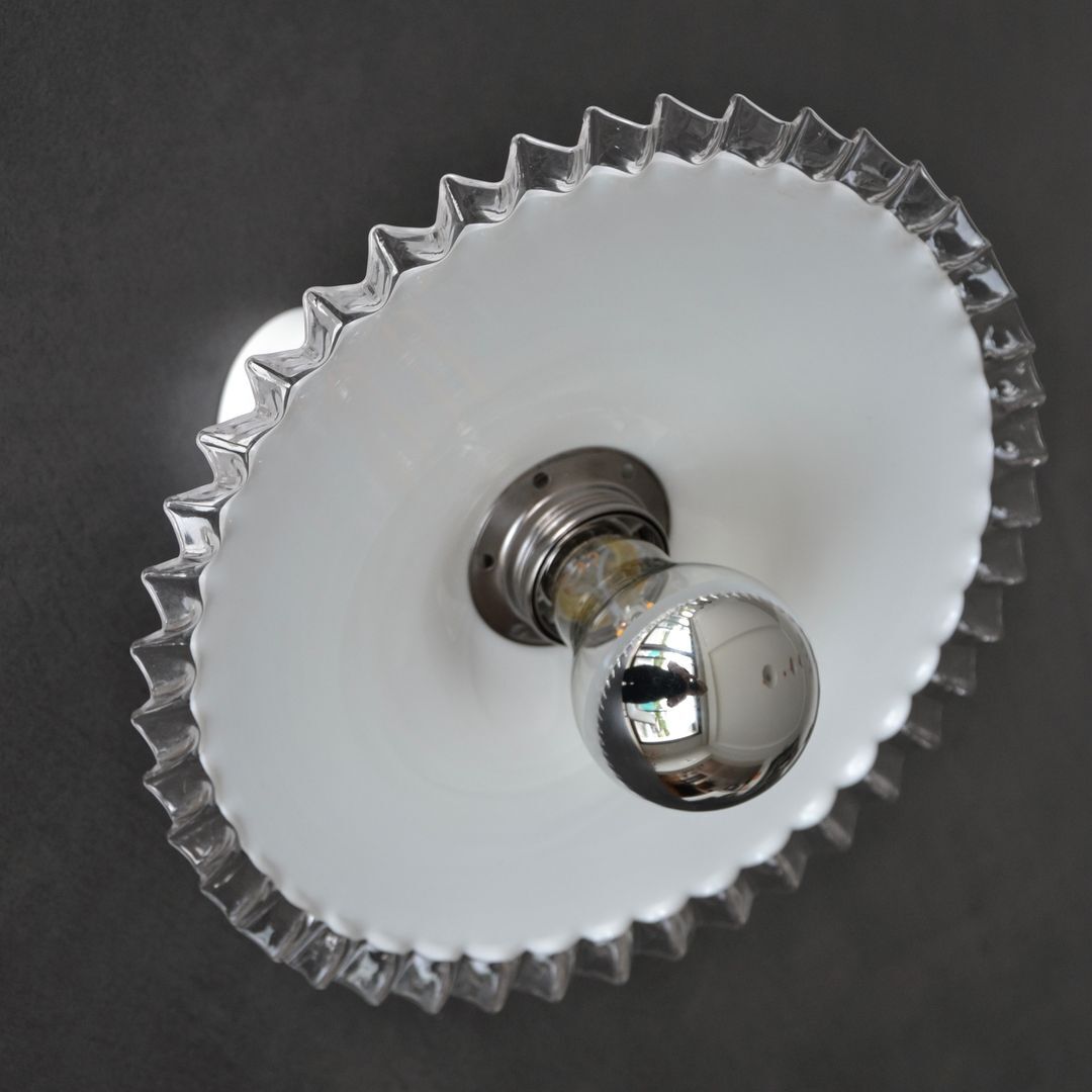 Articulated opaline pleated wall light