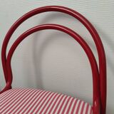 Red lacquered tubular chair