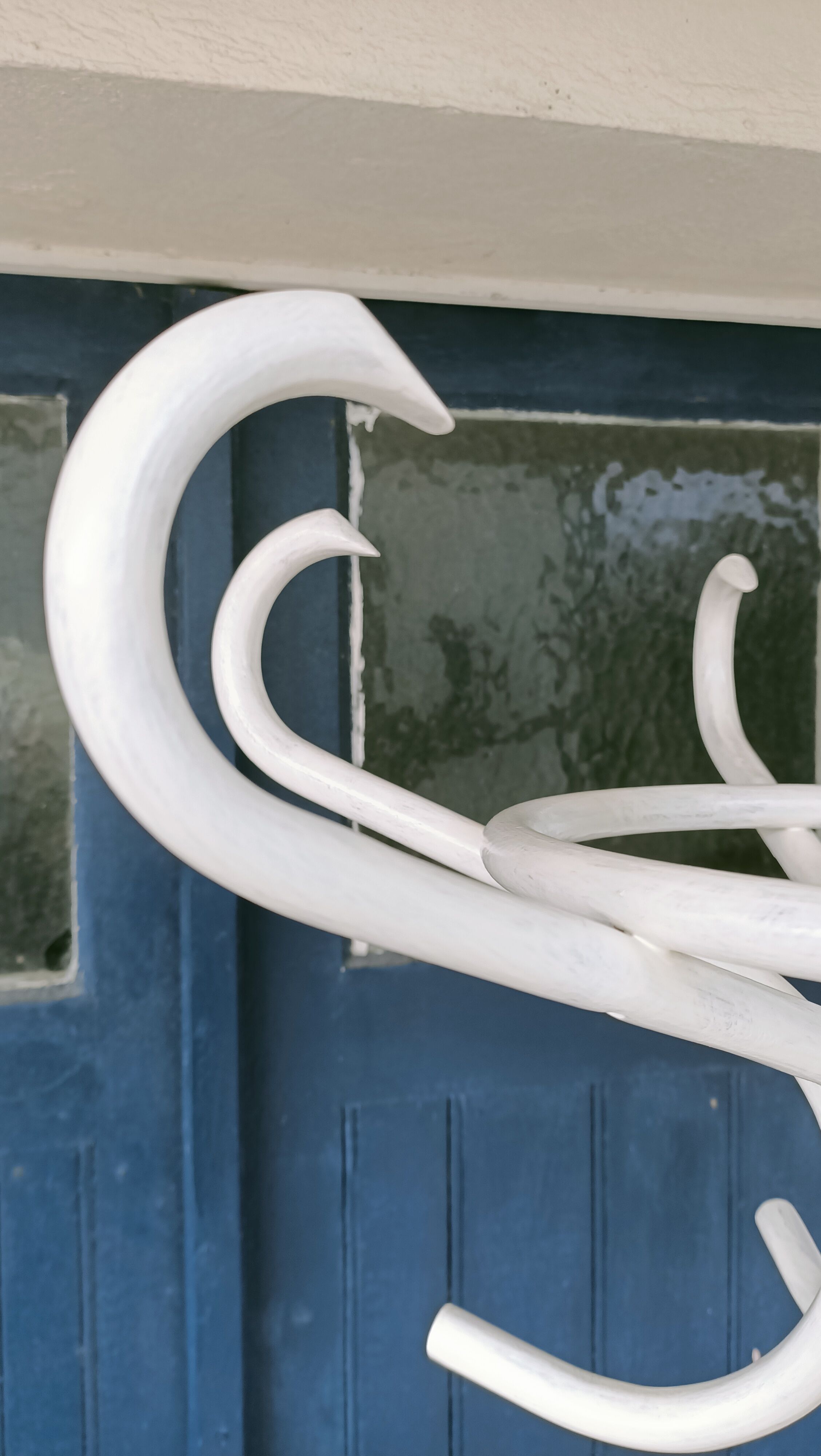 White parrot coat rack
