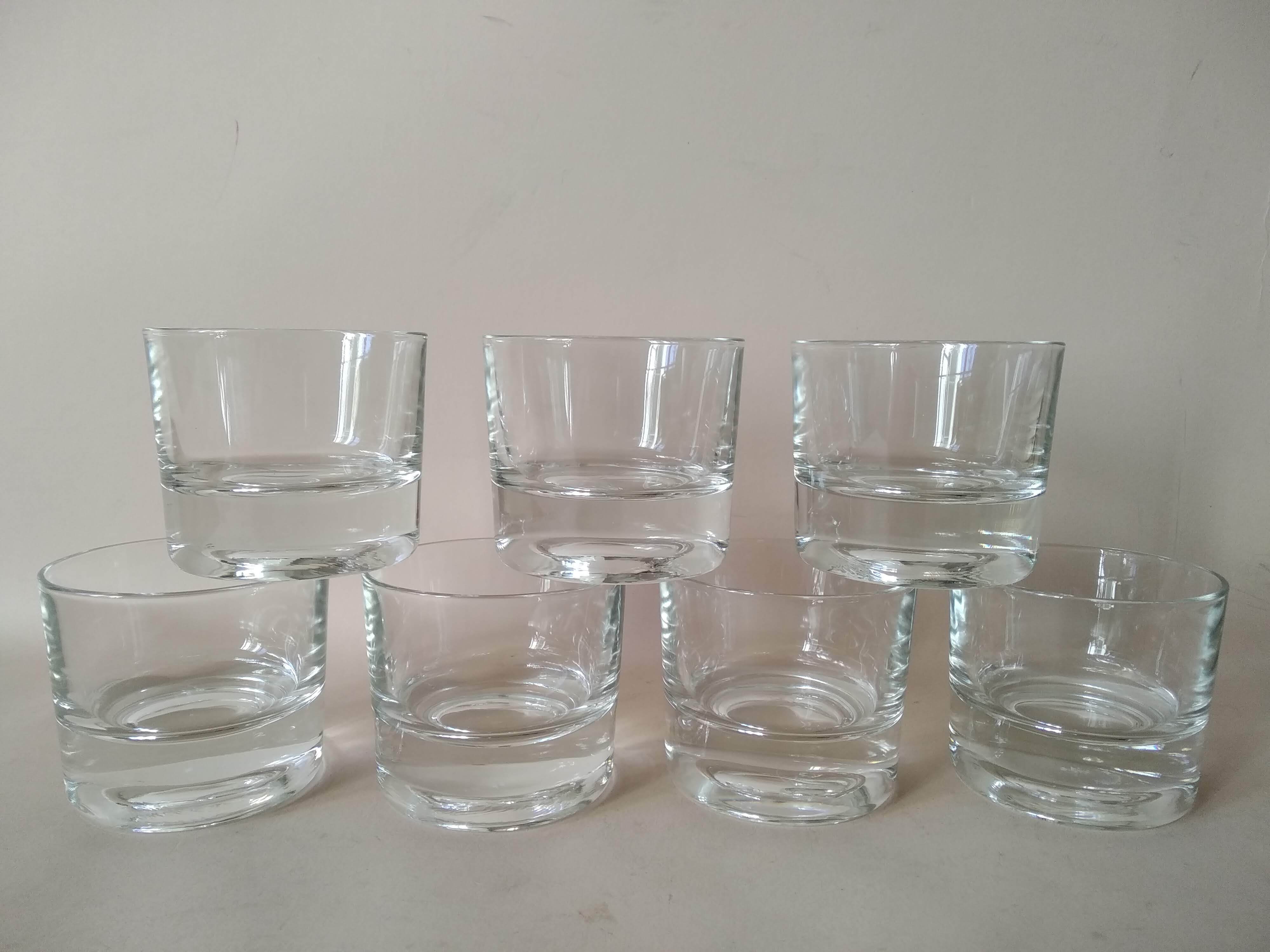 Glasses cups with thick bottom with water or vintage spirits 70
