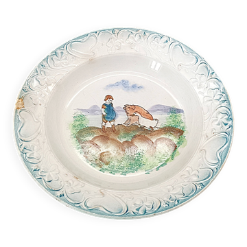 Large antique hollow dish from the 19th century, earthenware with pastoral decoration featuring a child, pig, and goose.