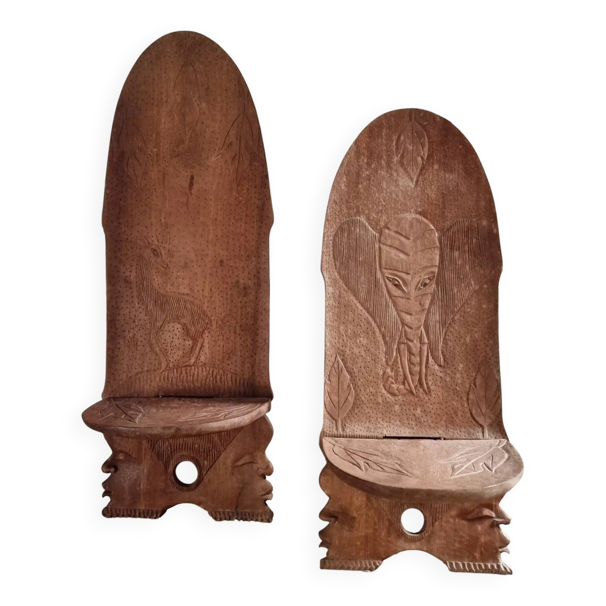 Pair of hand-carved wooden folding chairs – African origin, animal and face motifs, mid-20th century