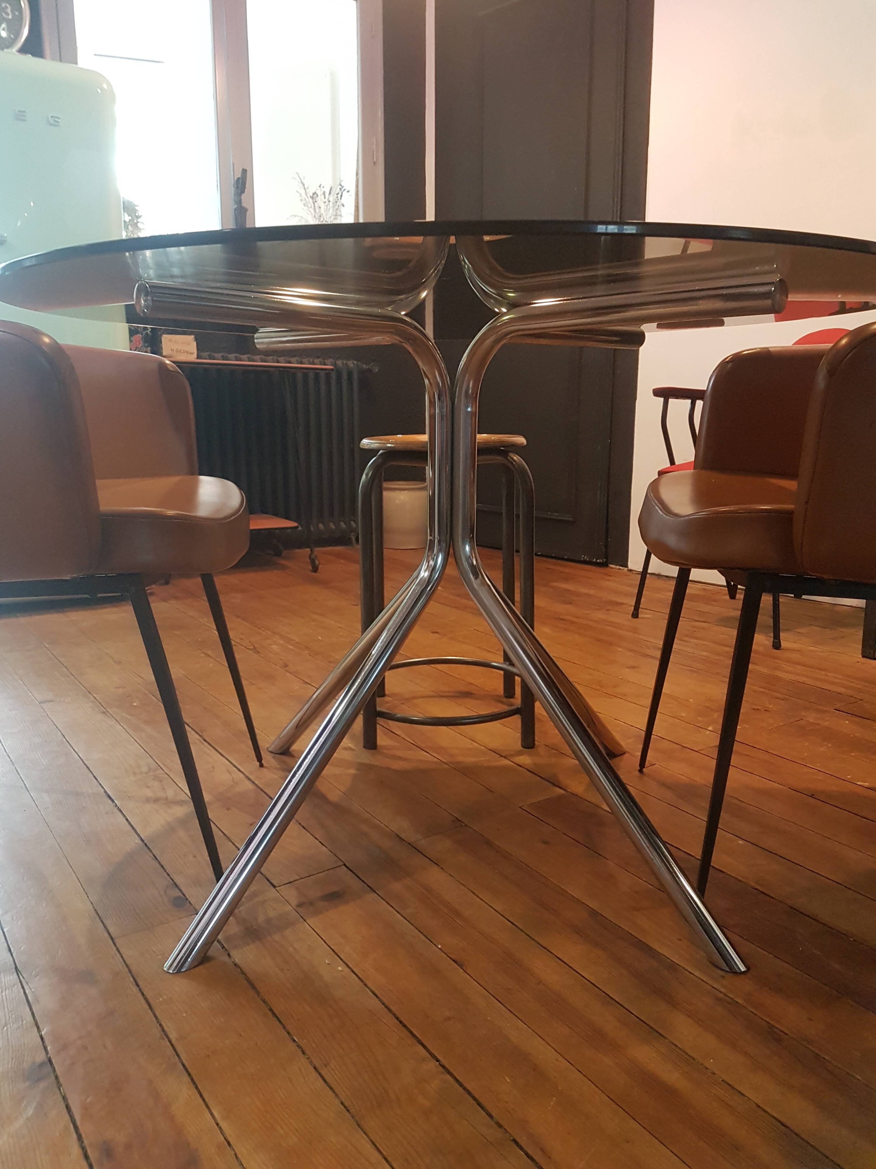 Smoked glass round table and chrome foot