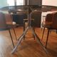Smoked glass round table and chrome foot