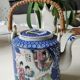 Japanese-inspired porcelain teapot.otifs Geishas kimonos, cherry blossoms