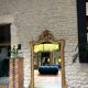 Antique mirror 169/105cm with pediments and pearl detailing in gold leaf.