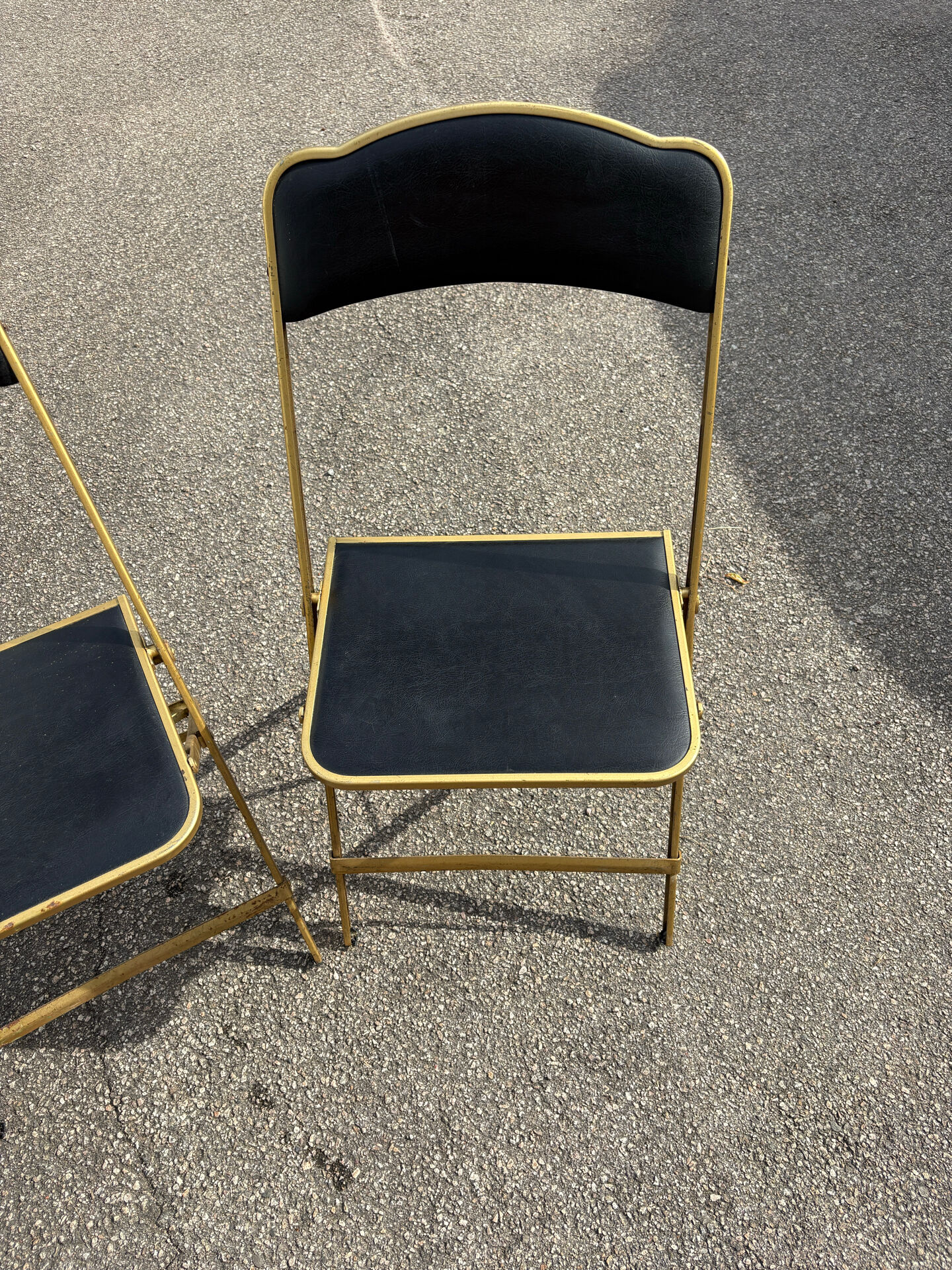 Two chairs, similar black