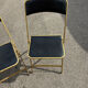 Two chairs, similar black