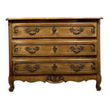 Curved Louis XV style chest of drawers in solid wood with light patina