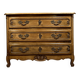 Curved Louis XV style chest of drawers in solid wood with a light patina
