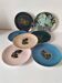 Set of 7 porcelain plates, gold foliage & jungle