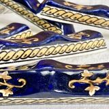 10 anciens porte couteau Gien Renaissance fond bleu
