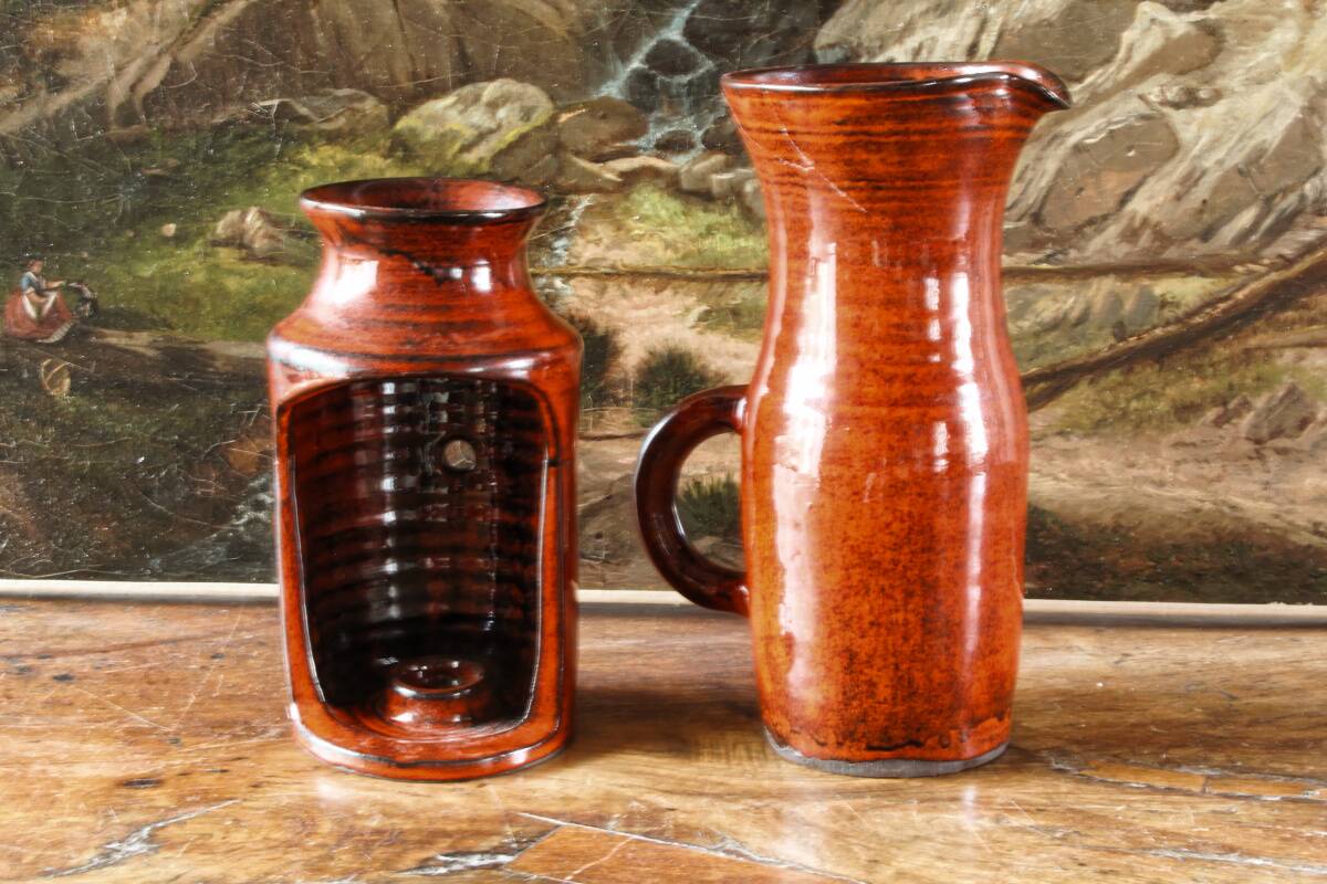 Signed orange ceramic candle holder and jug