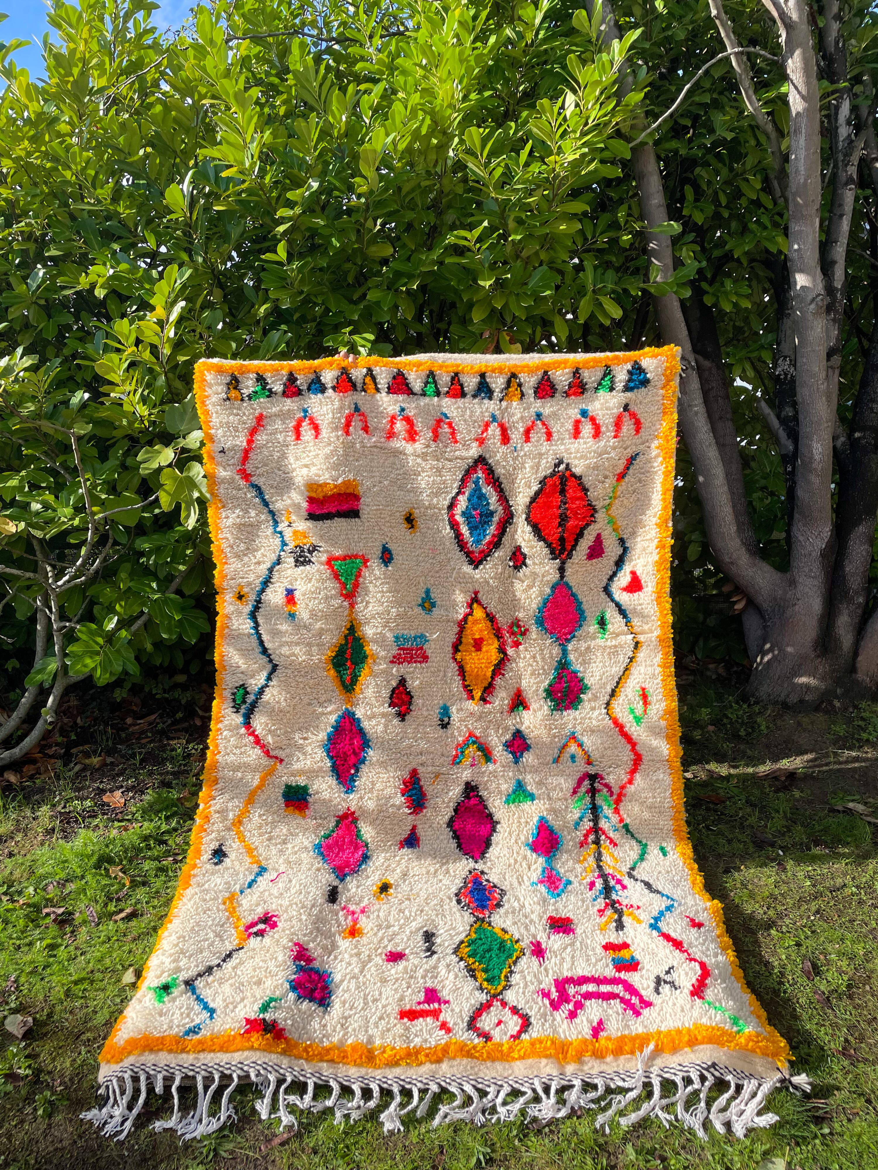 Berber carpet azimuth colored white with multicolored and fluorescent patterns
