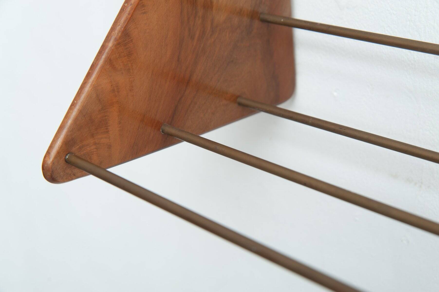 Wall-mounted walnut bookshelf by Carl Auböck, 1950s