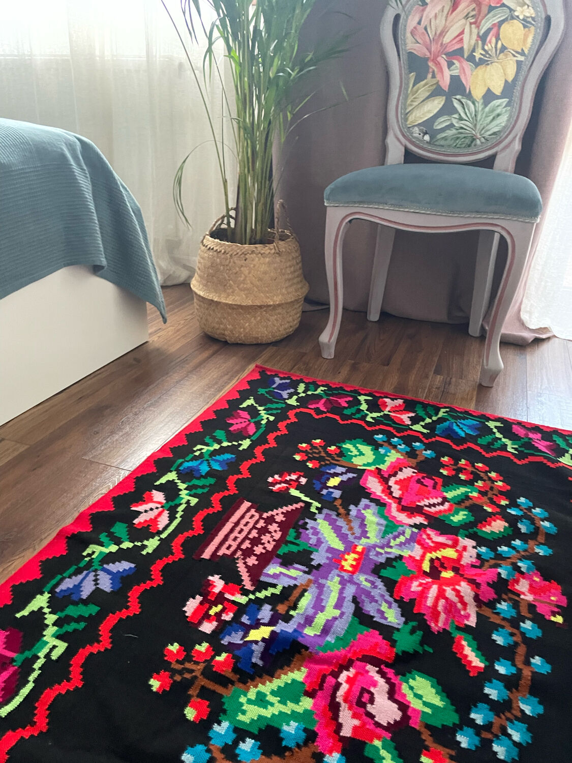 Vintage Romanian handwoven carpet with floral colorful design