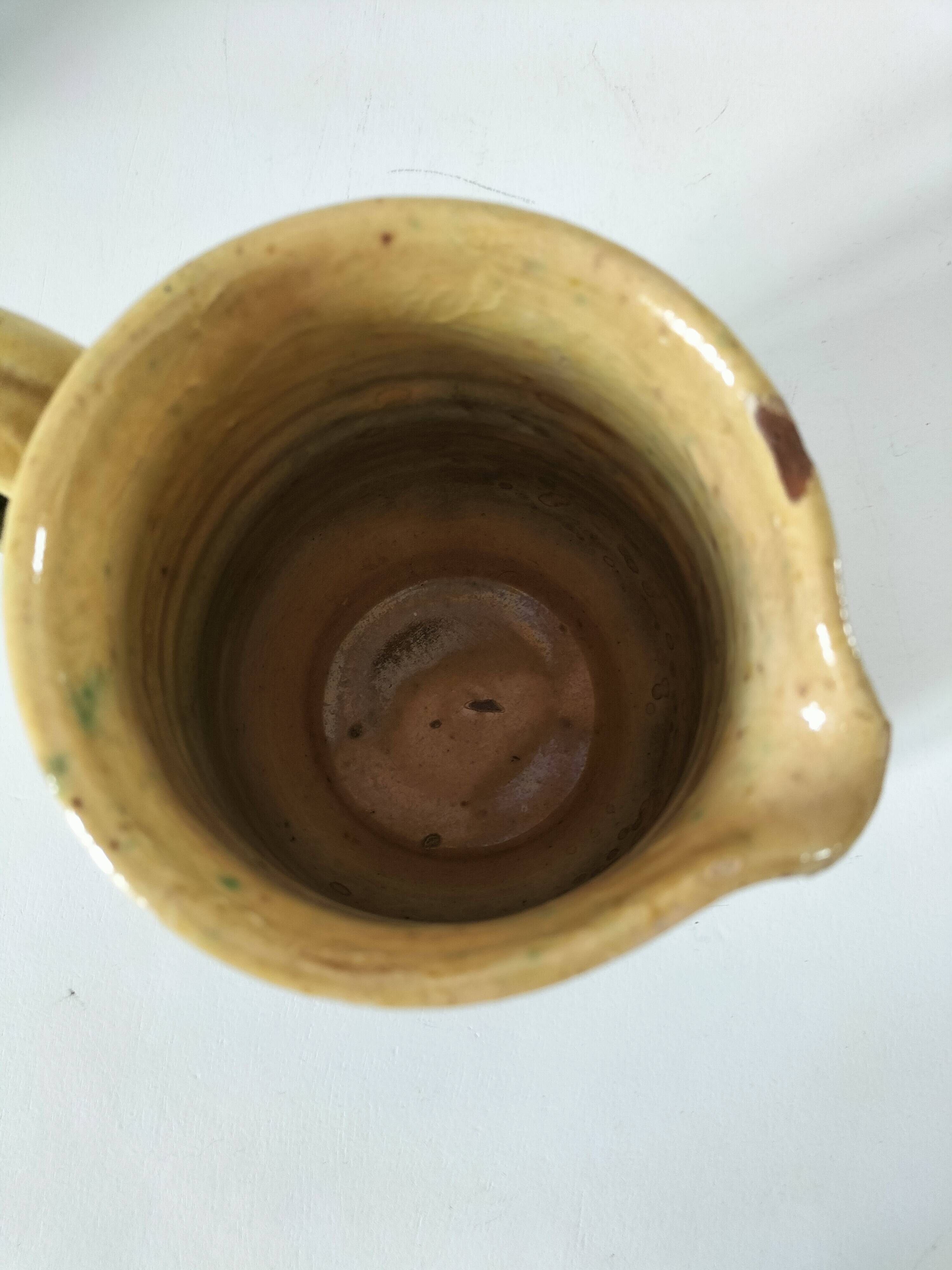 Glazed earthenware pitcher with abstract polychrome decoration, handmade.