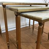 Pull-out tables in golden brass and marble