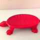 Turtle pocket emptier in enameled red cast iron by Castirone France